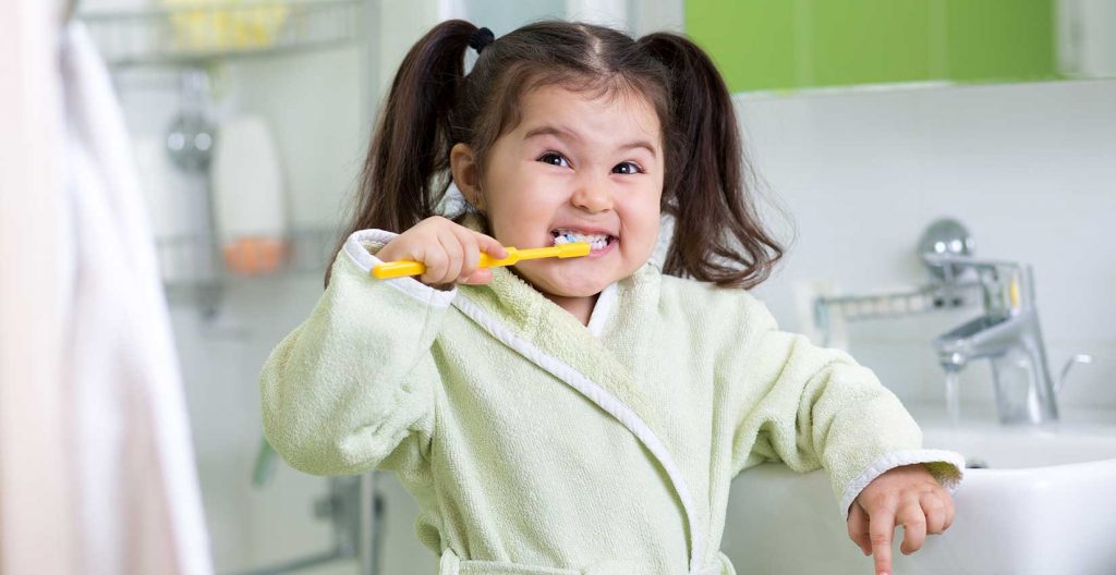 Child brushing teeth